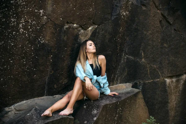 Resting after long way hiking. Pretty woman relax in mountains on idyllic summer day. Sexy woman sit on rocks on natural landscape. Sensual woman enjoy summer vacation. Best place to rest — Stock Photo, Image