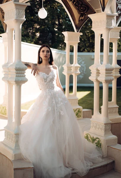 Woman is preparing for wedding. Happy bride before wedding. Wonderful bridal gown. Beautiful wedding dresses in boutique. Elegant wedding salon is waiting for bride. Extremely happy. Bride to be — Stock Photo, Image