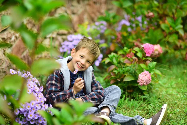In love with spring. Happy boy enjoy spring blossom. Little boy relax in spring garden. No spring skips its turn — Stock Photo, Image