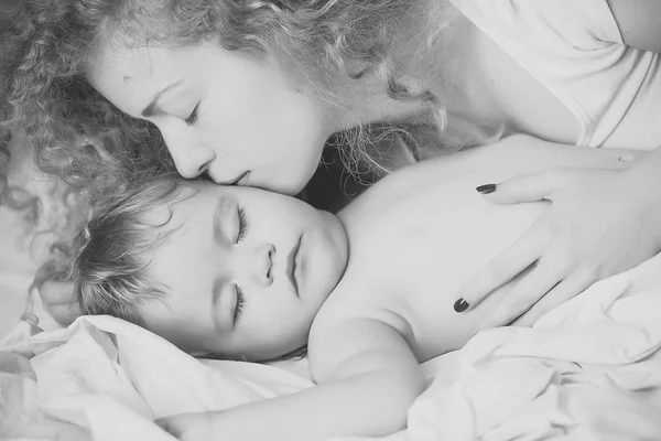 Mother kissing baby — Stock Photo, Image