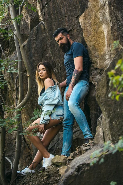 Love is in the air. Sensual couple on vacation trip. Couple in love on summer vacation. Sexy woman and bearded man on natural landscape. The best romantic vacation for couple