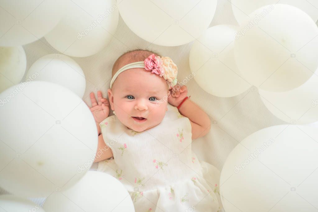 Here I am. Family. Child care. Childrens day. Sweet little baby. New life and birth. Portrait of happy little child in white balloons. Small girl. Happy birthday. Childhood happiness