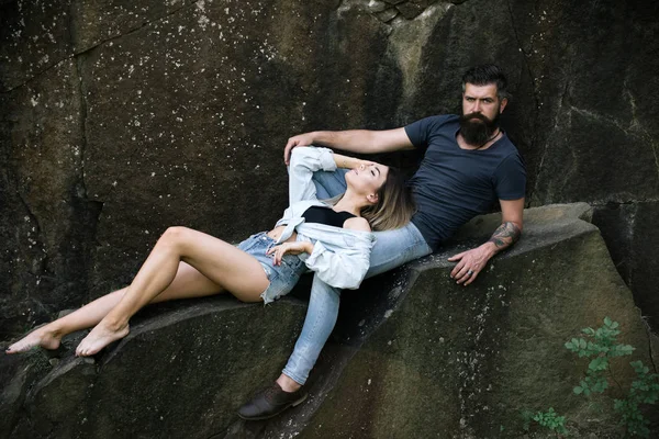 Simply in love. Couple in love on summer vacation. Sexy woman and bearded man on natural landscape. Sensual couple on vacation trip. The best romantic vacation for couple