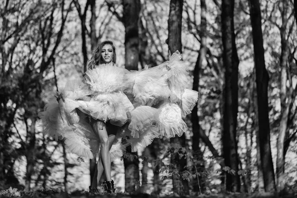 Glamour girl dancing in forest — Stock Photo, Image