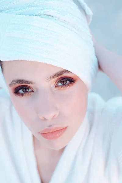 Girl With Towel On Head Relaxing, After Spa Or Morning Shower. Lady With  Mysterious Face And Decollete. Woman In Bathrobe After Wellness And Skin  Care Procedures. Rest, Wellness And And Care Concept.