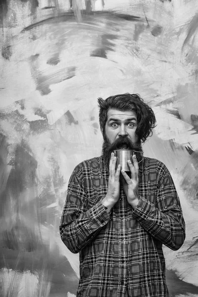 Happy bearded man with stylish fringe hair holding metal mug — Stock Photo, Image