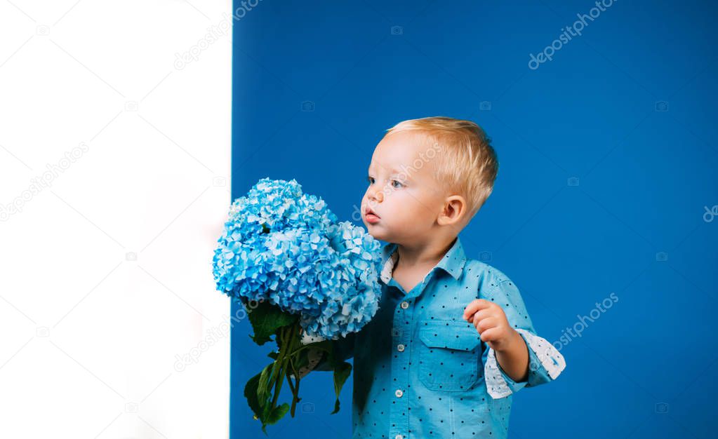 Little boy at blooming flower. Childrens day. Small baby boy. New life concept. Spring holiday. Summer. Mothers or womens day. Spring flowers. Childhood. Spring in my head