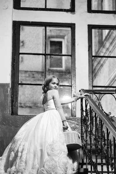 Small girl in white dress near big window — Stock Photo, Image