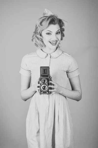 Retro woman with vintage camera. s