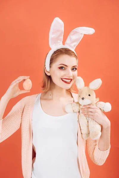 Happy woman in bunny ears with toy. Woman in rabbit bunny ears. Happy easter. Spring holiday. Girl with hare toy. Egg hunt. Bunny with Easter eggs. traditional food. Collecting Easter eggs — Stock Photo, Image
