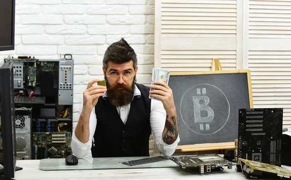 Bitcoin mining farm. Bearded businessman with computer circuits for bitcoin mining. Bitcoin miner man in server room. Bearded man bitcoiner. Crypto currency mining hardware. Virtual digital currency