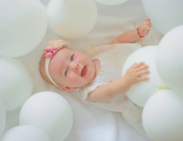 We are family. Sweet little baby. New life and birth. Small girl. Happy birthday. Family. Child care. Childrens day. Portrait of happy little child in white balloons. Childhood happiness