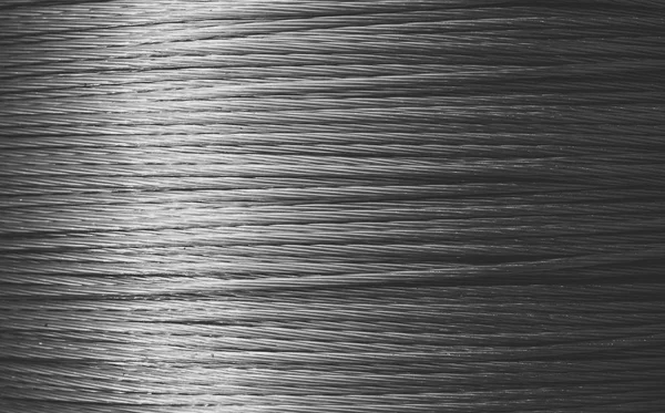 Hermoso fondo metálico, textura de cuerda. Cuerda de acero o metal . —  Fotos de Stock