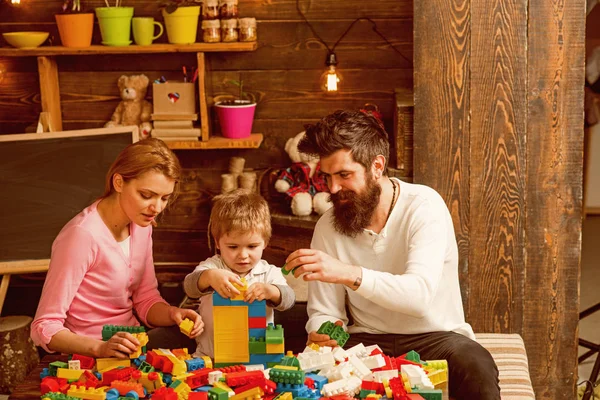 Family concept. Family play with colorful bricks. Family build structure with toy bricks. Family love and trust