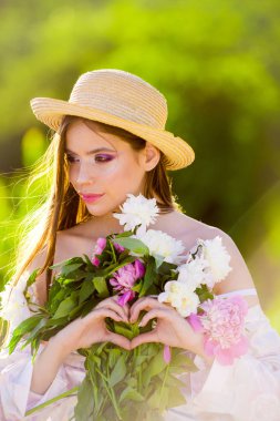 It is spring time. Woman with fashion makeup. Summer girl with long hair. Spring woman. Springtime and vacation. face and skincare. Travel in summer. Natural beauty and spa therapy