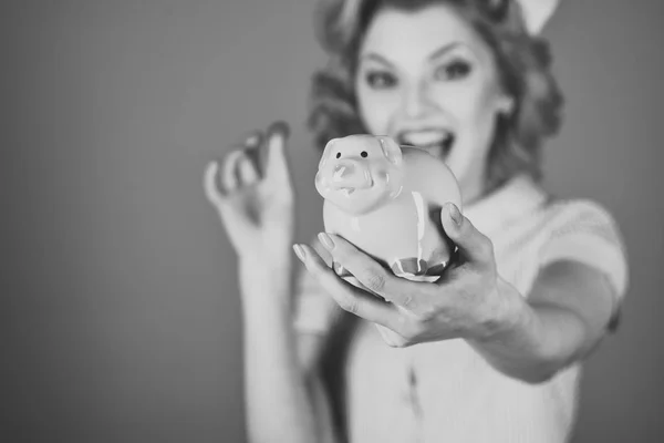 Retro woman hold moneybox, piggy bank for savings.