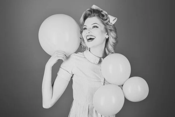 Pin up woman with balloons, birthday.