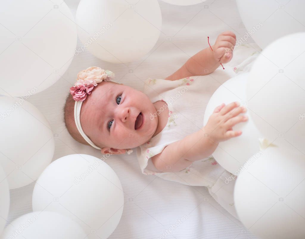 Good morning sunshine. Family. Child care. Childrens day. Small girl. Happy birthday. Portrait of happy little child in white balloons. Childhood happiness. Sweet little baby. New life and birth