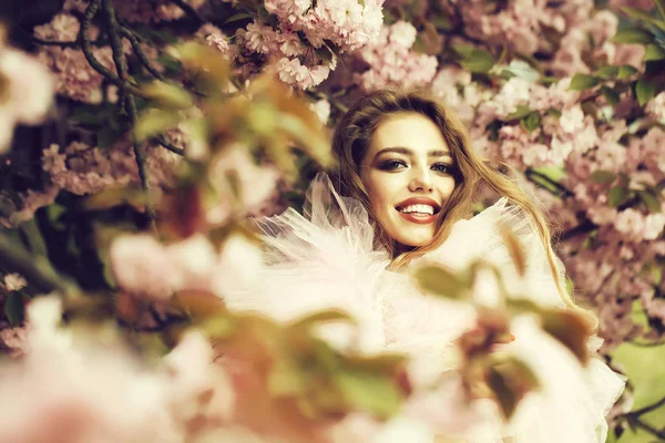 Happy woman in blossom — Stock Photo, Image