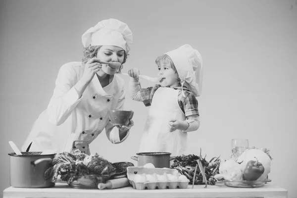 Chef and assistant near kitchen equipment and food products. — Stock Photo, Image