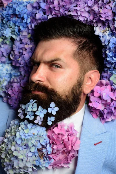 Male with hydrangea flowers. brutal caucasian hipster with moustache. spring. womens day. Mature hipster with beard. Healthy hair and skin. Bearded man. Summer. Stylish and confident — Stock Photo, Image