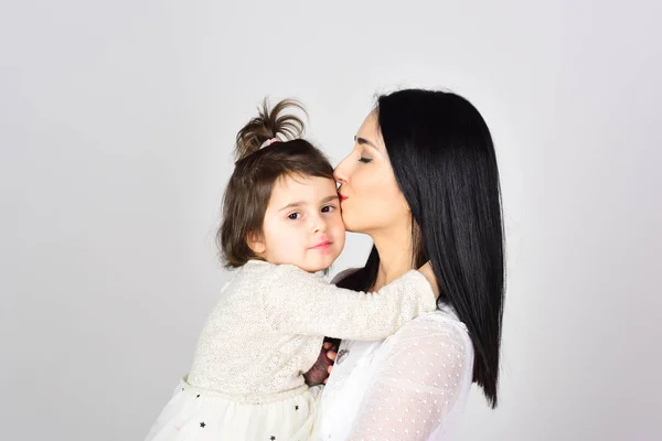 Happy woman with little girl. Mothers day. Childrens day. Mother and daughter. Beauty and fashion. Love and family. Stylish and confident. You are my everything. I want to play
