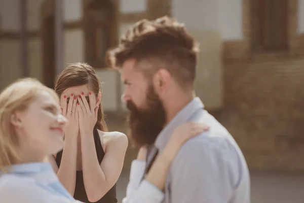 Cant see them together. Bearded man cheating his woman with another girlfriend. Unhappy woman feeling jealous. Romantic couple of man and woman dating. Jealous girl look at couple in love on street — Stock Photo, Image