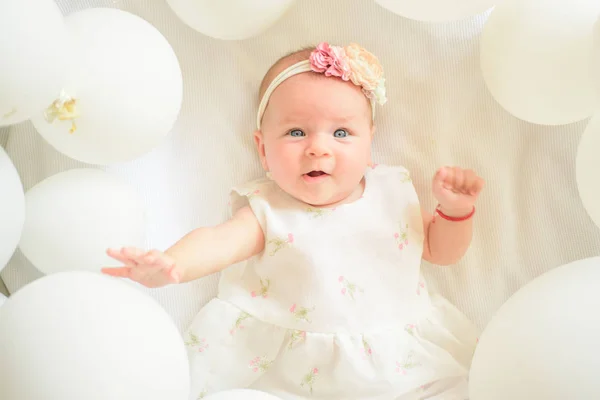 Day sleeping. Family. Child care. Childrens day. Small girl. Happy birthday. Portrait of happy little child in white balloons. Childhood happiness. Sweet little baby. New life and birth