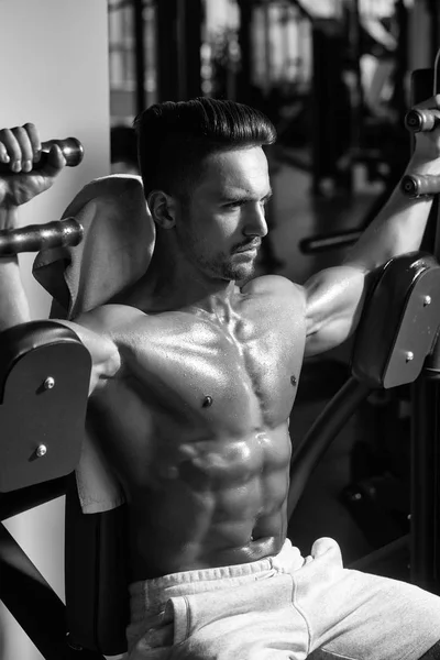 muscular man training in gym