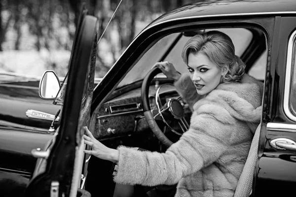 Escort and security guard for luxury woman. sexy woman in fur coat. Travel and business trip or hitch hiking. Call girl in vintage car. Retro collection car and auto repair by driver — Stock Photo, Image