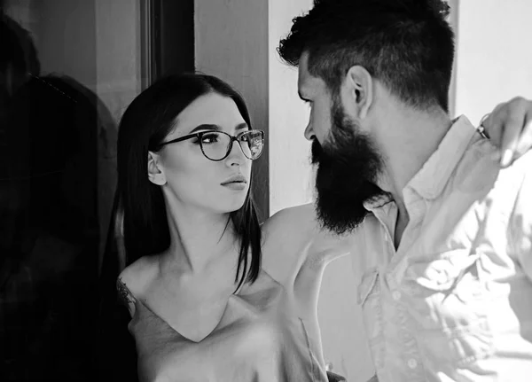 In love with fashion. Couple in love. Girlfriend and boyfriend in relations of friendship. Couple of lovers with fashion style. Sensual woman and bearded man in love relations. Fashion models