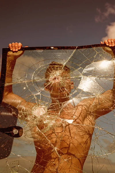 His great ambition is to become a champion. Sport man with muscular strength. Achieving sport ambition with right workout. Strong man hold cracked glass. Focus on building strength and power — Stock Photo, Image