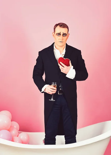 I love you. Comedian actor hold red heart and wine glass. Happy valentines day. Mime actor has valentines celebration party. Mime man celebrate valentines day in bath. Time to celebrate love