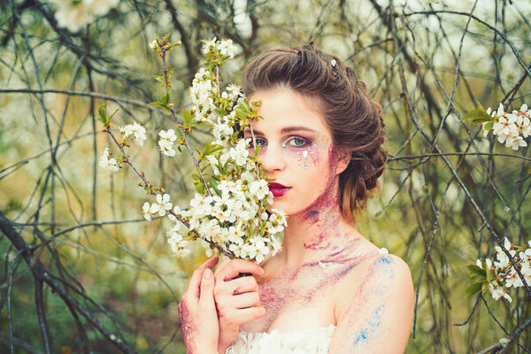 Summer holidays. Natural beauty and spa therapy. Summer girl at blooming tree. face and skincare. womens health. allergy to flowers. Springtime. weather forecast. Woman with spring fashion makeup.