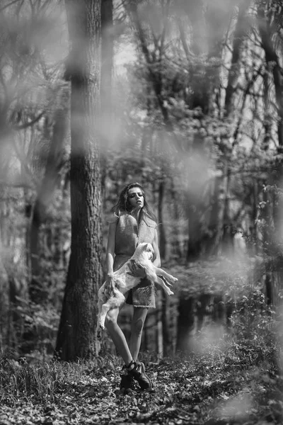 Young girl with goat in forest — Stock Photo, Image