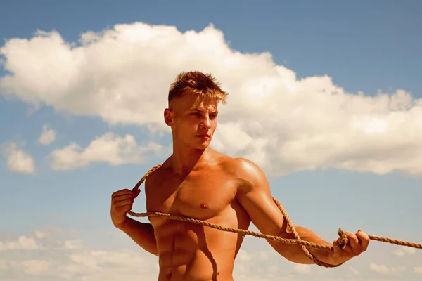 Ambition and energy. Athlete with fit sexy torso. Sport exercises for building strength and power. Achieving ambition in sport. Strong man pull rope. Sport man develop muscular hand strength — Stock Photo, Image