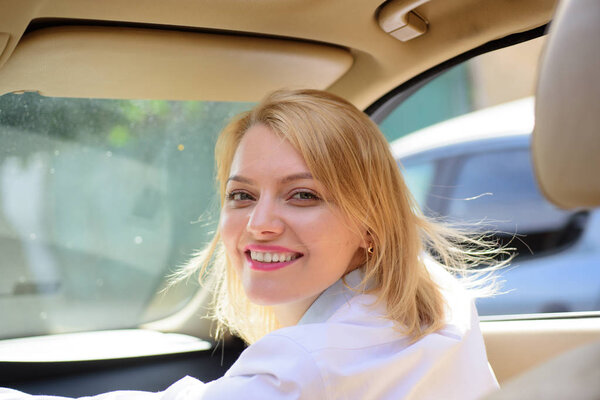 Eco friendly and sustainable travel. Pretty woman travel by automobile transport. Sexy woman enjoy traveling by road transport. Eco driving is an ecologic driving style. Reducing CO2 emissions