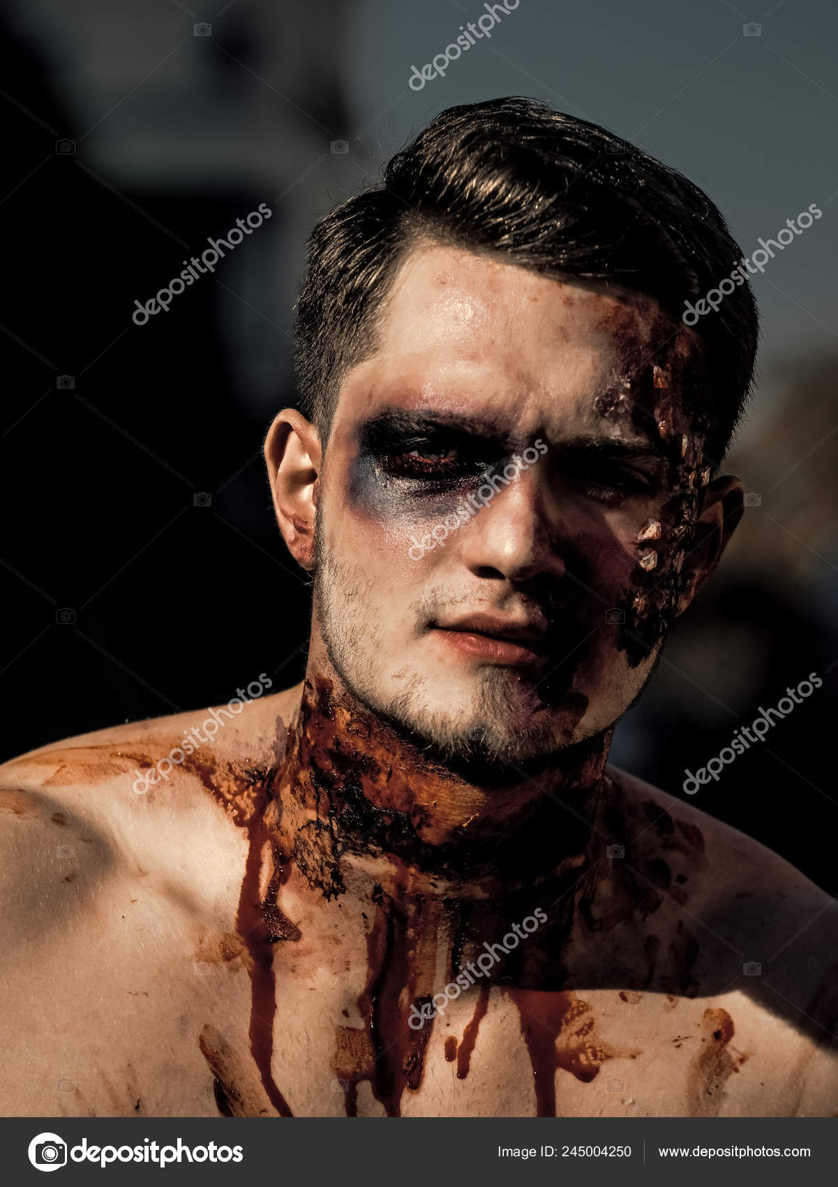 Maquiagem masculina zumbi para o conceito de halloween. sangue na pele do  rosto