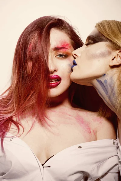 Fashion concept. Women with fashion makeup. Fashion woman kiss girlfriend. Passion for fashion