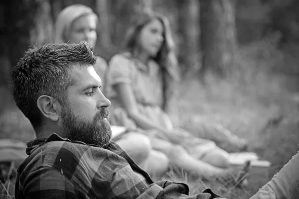 Man and women on blurred background in wood. Hiking, camping, lifestyle concept