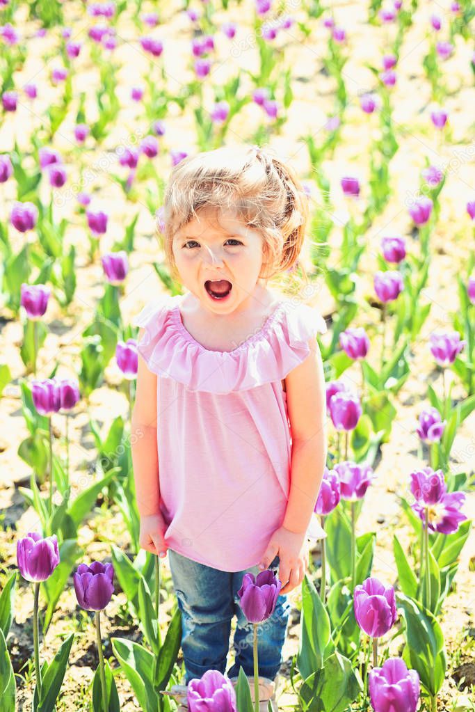 Spring everywhere. face and skincare. allergy to flowers. Small child. Natural beauty. Childrens day. Little girl in sunny spring. Summer girl fashion. Happy childhood. Springtime tulips