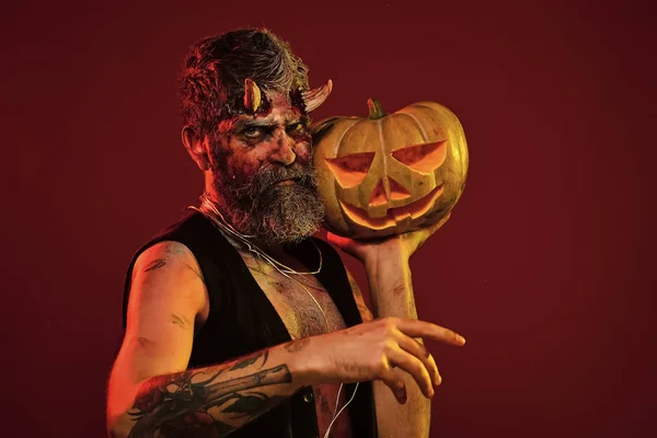 Halloween satan with bloody horns, beard, blood, wounds