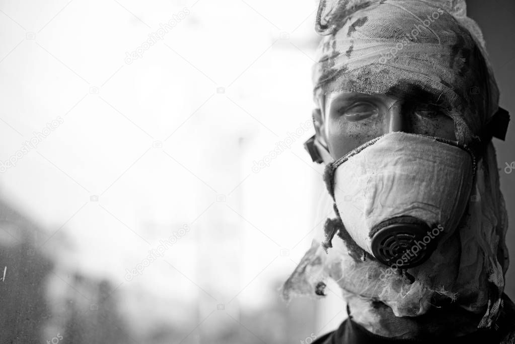 War is a crime against humanity. Dummy man wear gas mask against chemical attack. War victim dummy casualty. Dummy of war soldier. Victim of armed conflict. Badly wounded and injured, copy space