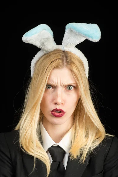Young girl easter woman in bunny ears. Beautiful young woman with bunny ears and blank poster on black background isolated. Easter dinner menu. Happy woman in bunny ears with easter egg. — Stock Photo, Image