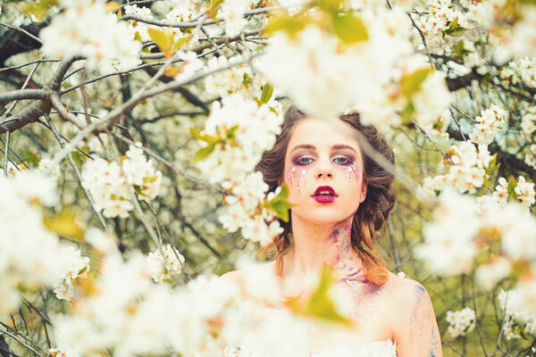 Spring depression. Natural beauty and spa therapy. face and skincare. womens health. allergy to flowers. Woman with spring fashion makeup. Springtime. weather forecast. Summer girl at blooming tree.