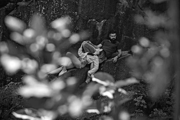 Relaxing after hiking. Sensual couple on vacation trip. Couple in love on summer vacation. Sexy woman and bearded man on natural landscape. Couple enjoy love and romance — Stock Photo, Image