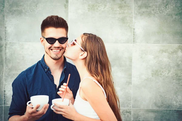 Order something warm and relax. Couple in love drink coffee outdoor. Couple of woman and man with coffee cups. Enjoying the best coffee date. Girlfriend and boyfriend have espresso or latter drink