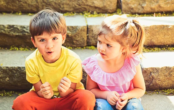 best friends, friendship and family values. summer holiday and vacation. childhood first love. small girl and boy on stairs. Relations. couple of little children. Boy and girl. summer morning