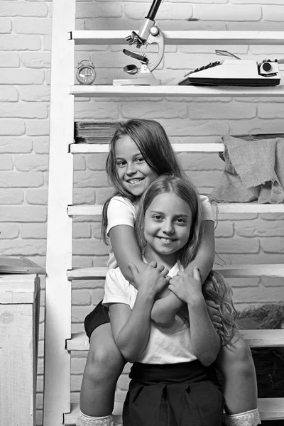School. happy friends girls embrace in school classroom. — Stock Photo, Image