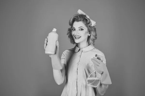 Retro woman cleaner on blue background.